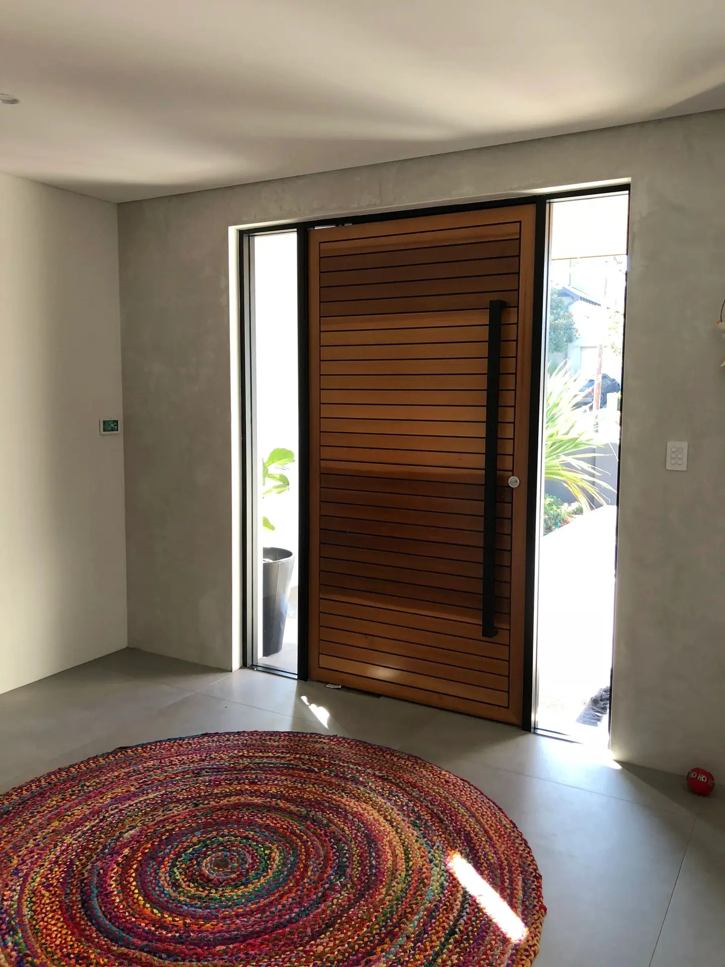 Custom timber pivot door and internal opening