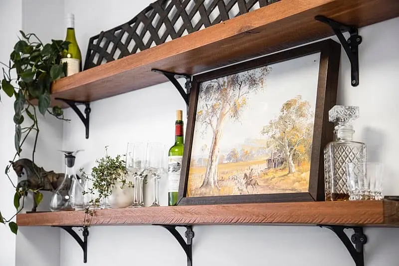 Hardwood display shelves fitted above a renovated Bondi apartment kitchen