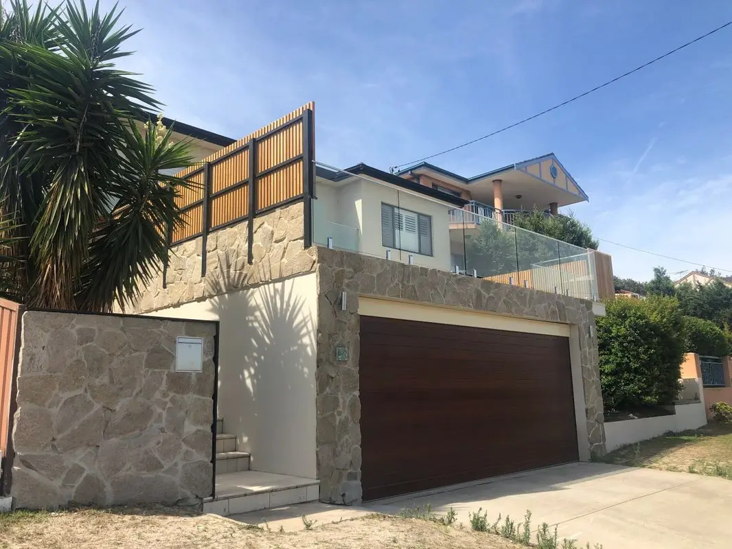 Completed Chifley facade renovation with vertical Blackbutt privacy screening