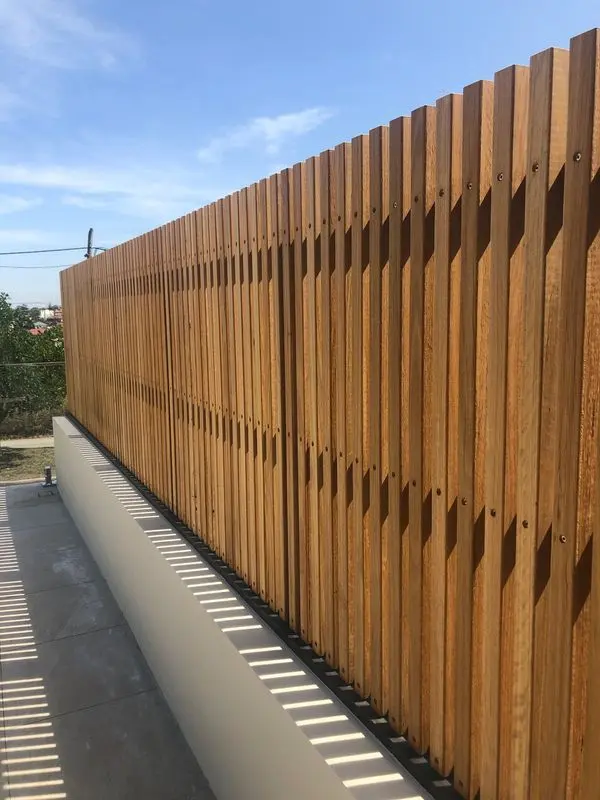 Custom Blackbutt batten privacy screen completed in Chifley