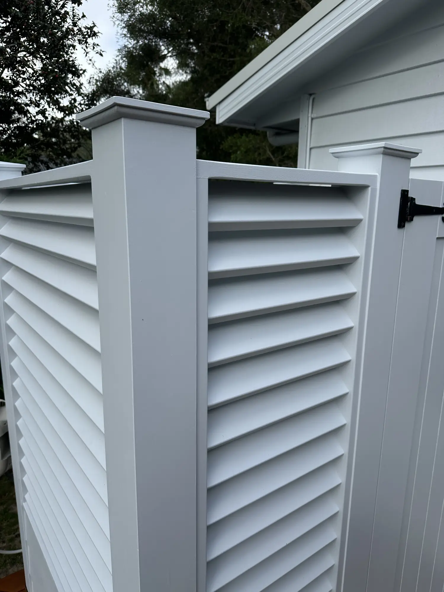 Angled louvres balancing privacy and airflow at the Erina Heights outdoor shower