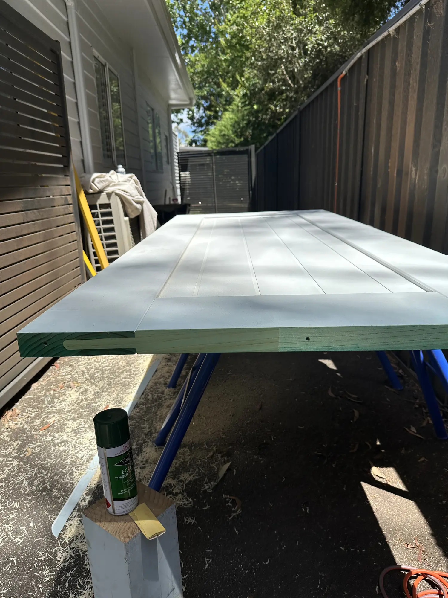 Ecoseal preservative applied to cut timber for the Erina Heights outdoor shower door