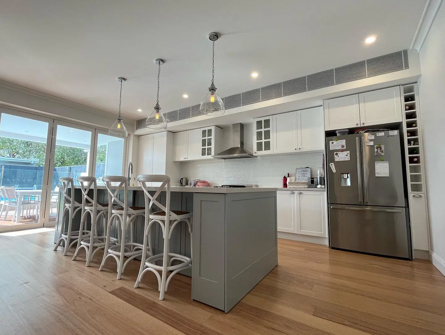Kitchen island, cabinetry and hardwood floor completed in a Maroubra renovation