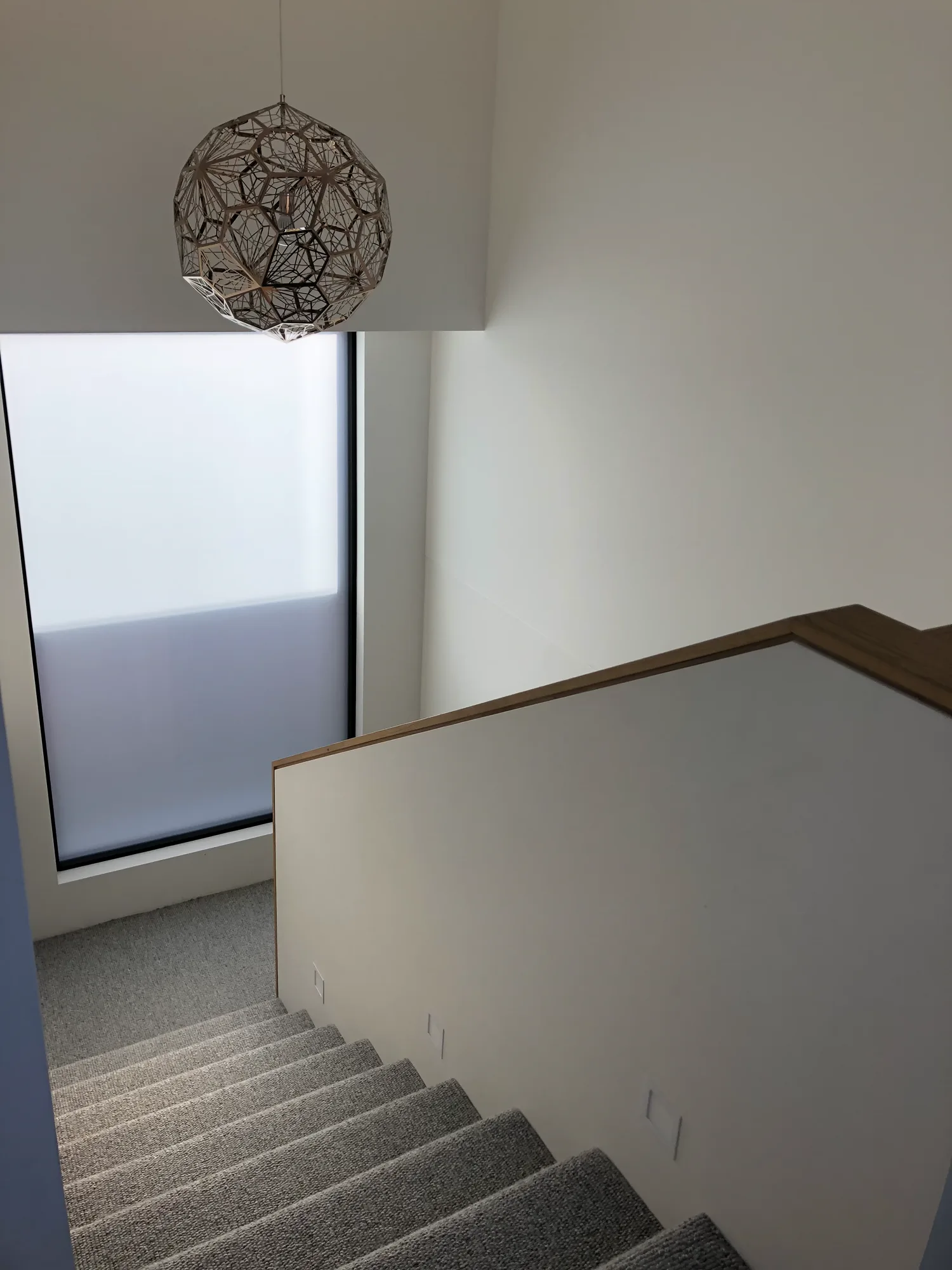 American Oak handrail integrated into the Kensington stairwell