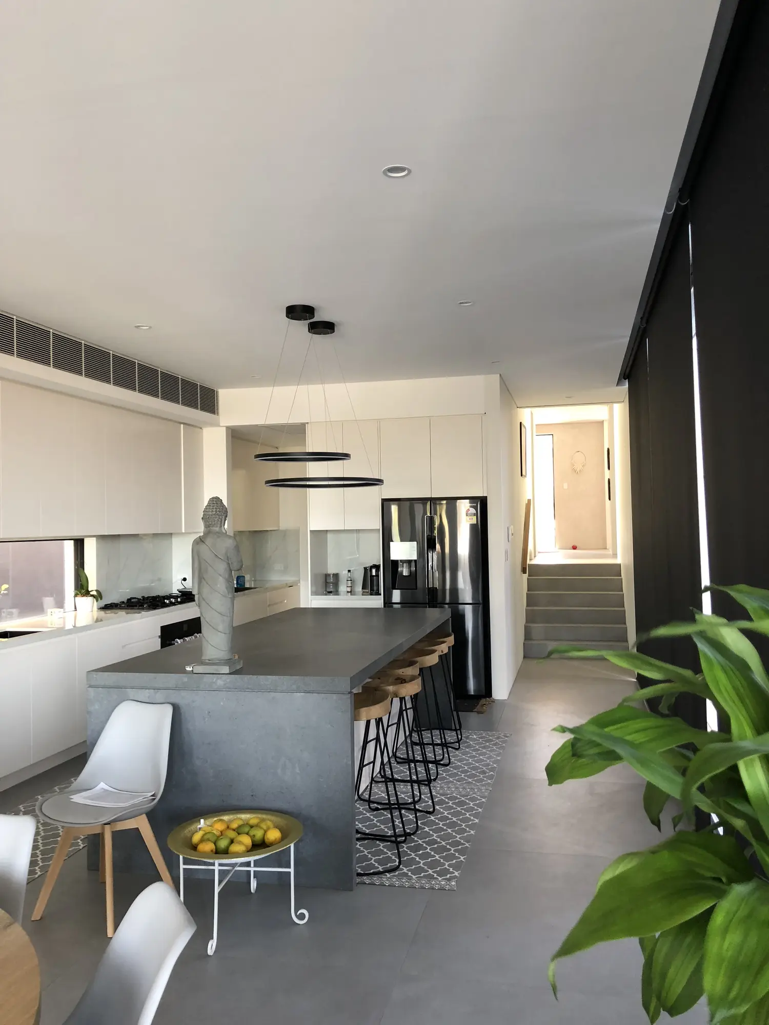 Architectural kitchen island and full-height cabinetry in Kensington