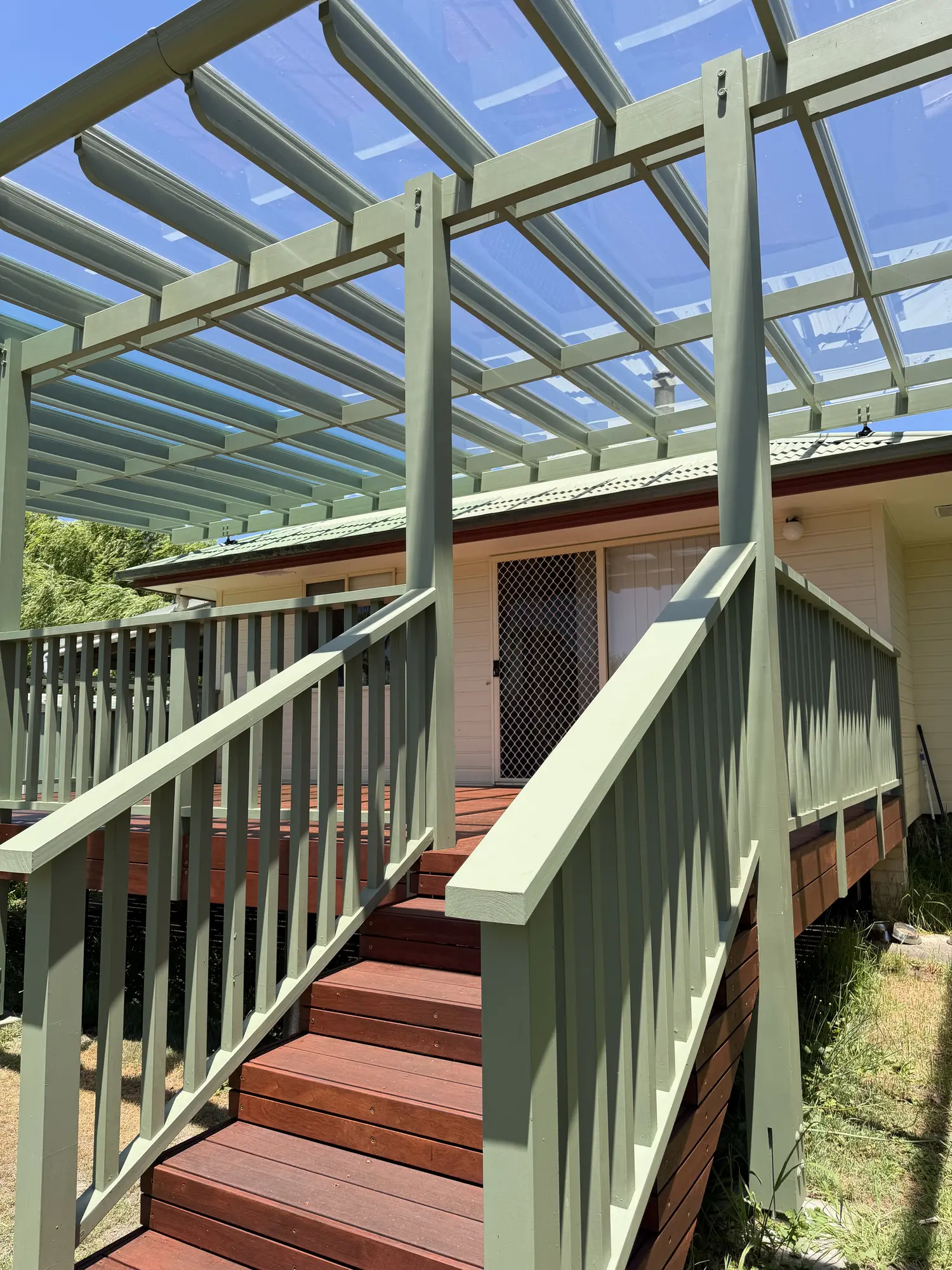 Merbau deck, outdoor stair and detailed pergola completed in Lisarow