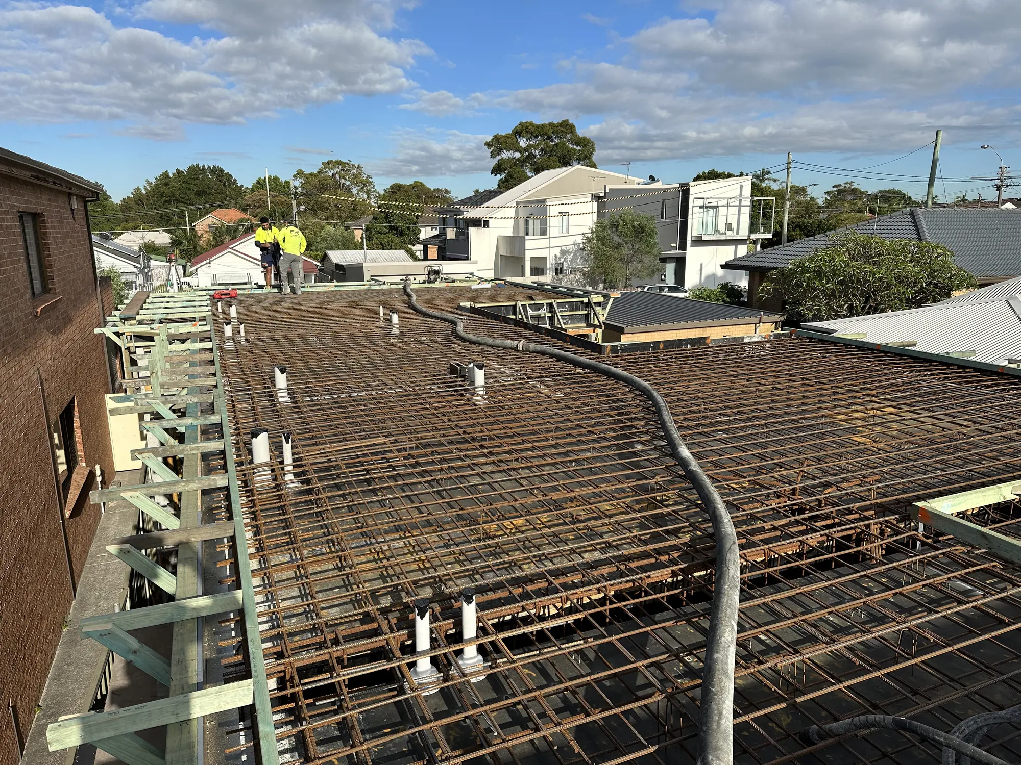 Reinforcement and service penetrations prepared before a concrete pour in Mascot