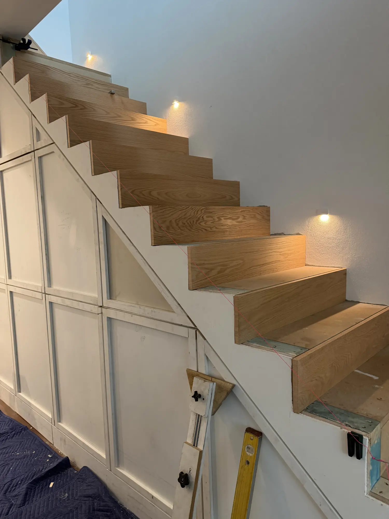 Floating American Oak stair treads aligned through a turning Surry Hills staircase