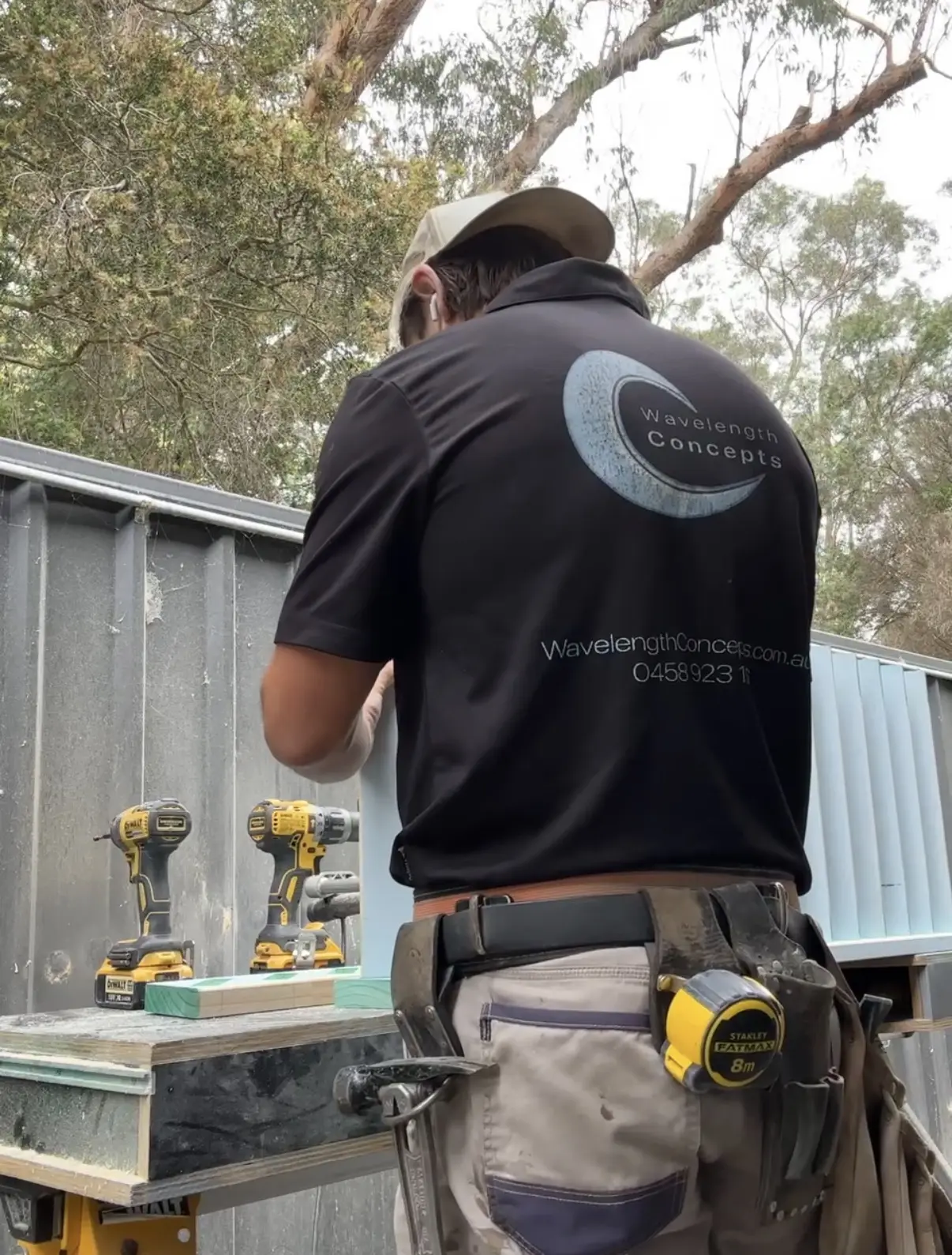 Zach building the custom Merbau outdoor shower and deck in Erina Heights