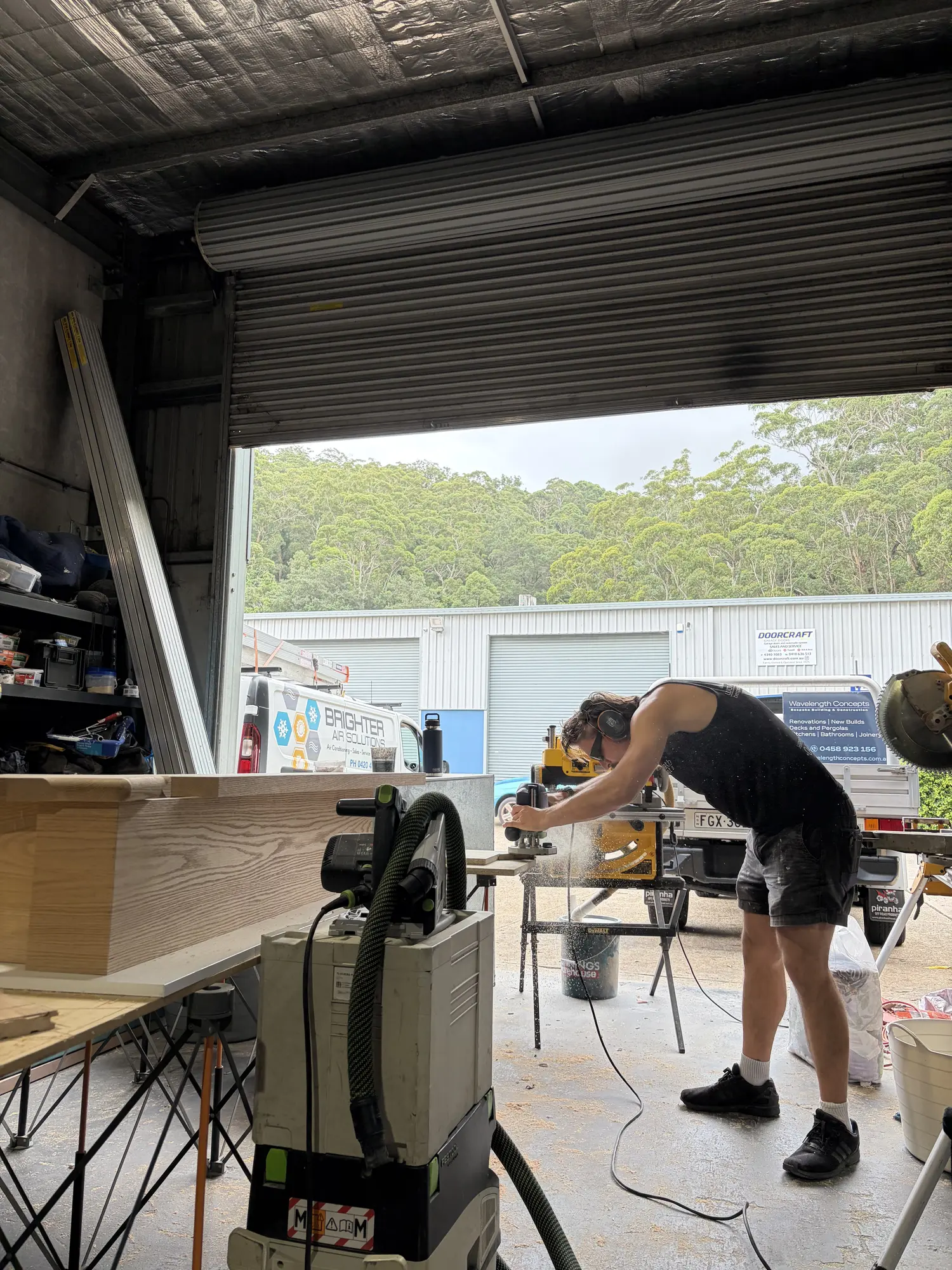Zach Waterhouse fabricating staircase components in the Central Coast workshop
