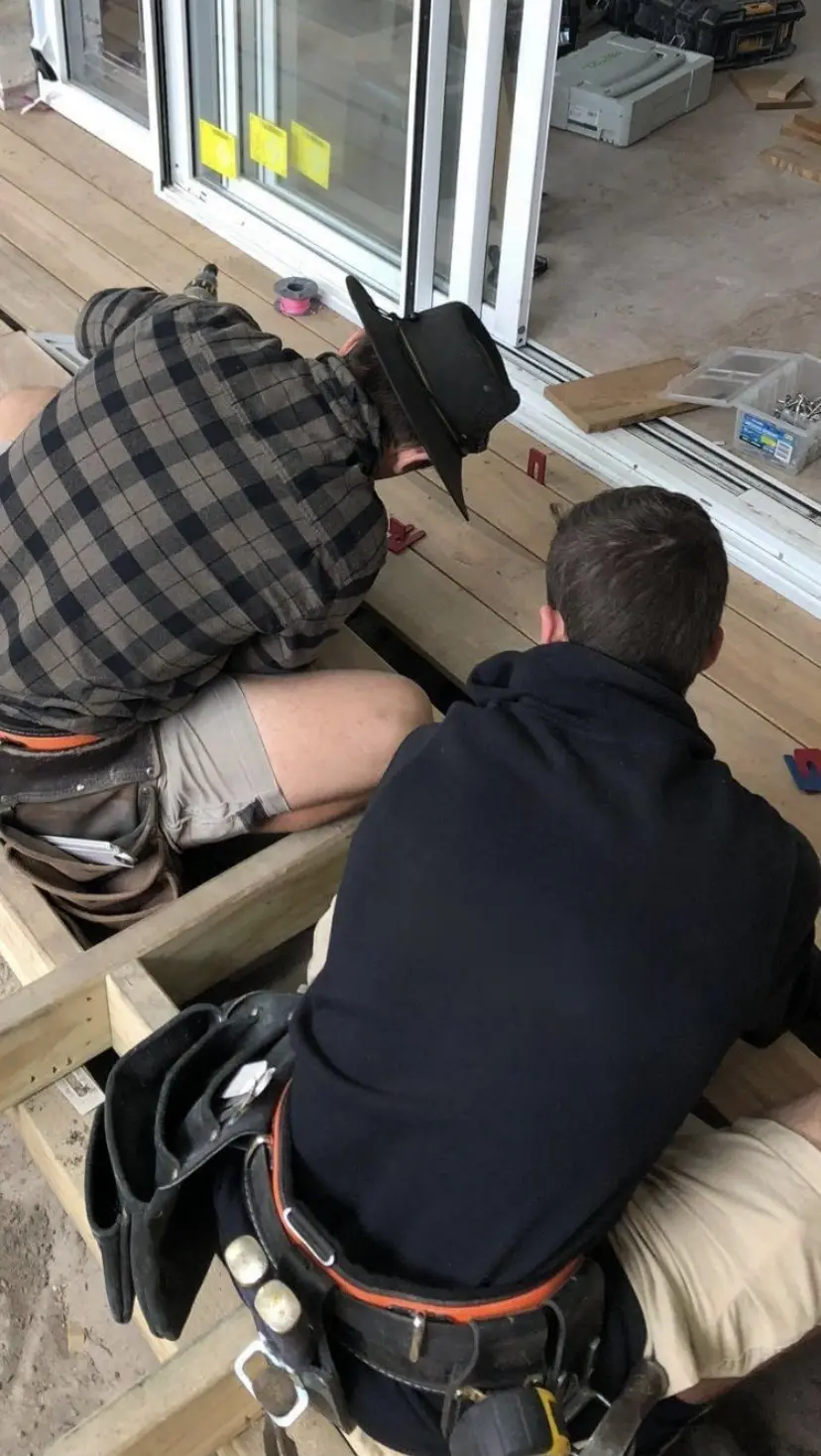 Zach Waterhouse teaching detailed framing and deck carpentry on site in Maroubra